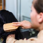 brushing a synthetic wig