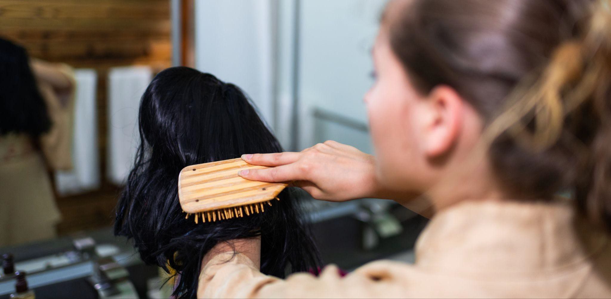 brushing a synthetic wig